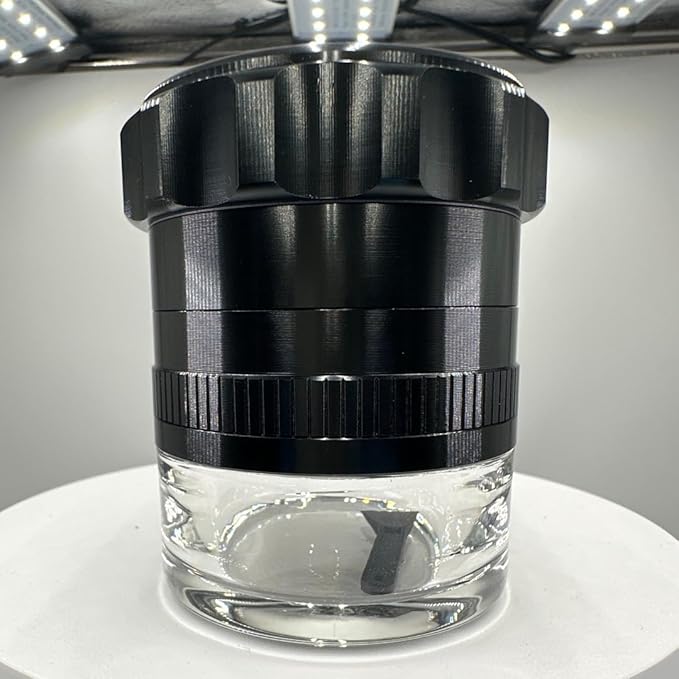 Spice Grinder. 2.5 inch herb grinder with jar attached. Jar offers a larger storage capacity. Anodized Aluminum alloy with glass bottom. (Black, 2.5 Inches x 3 Inches)