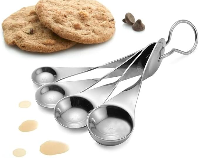 Nambé Alvaro Uribe Measuring Spoon Set – 4 Stainless Steel Spoons with Artistic Twisted Handles, Metric & Standard Markings, Rust-Resistant Easy-Clean Utensils for Cooking & Baking Precision