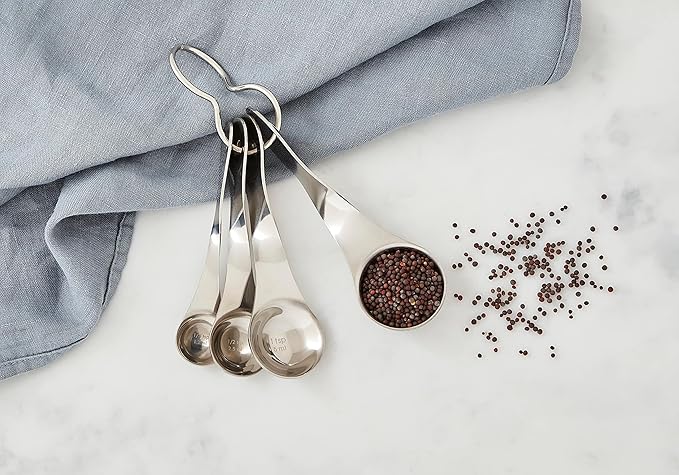 Nambé Alvaro Uribe Measuring Spoon Set – 4 Stainless Steel Spoons with Artistic Twisted Handles, Metric & Standard Markings, Rust-Resistant Easy-Clean Utensils for Cooking & Baking Precision